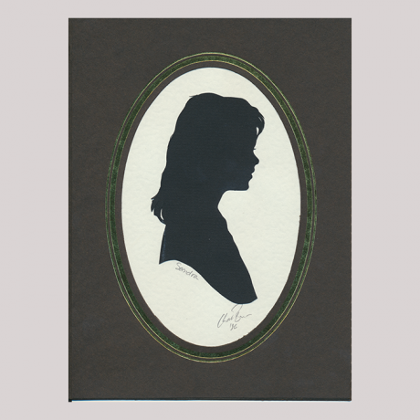 
        Front of silhouette, with girl in frame looking left.